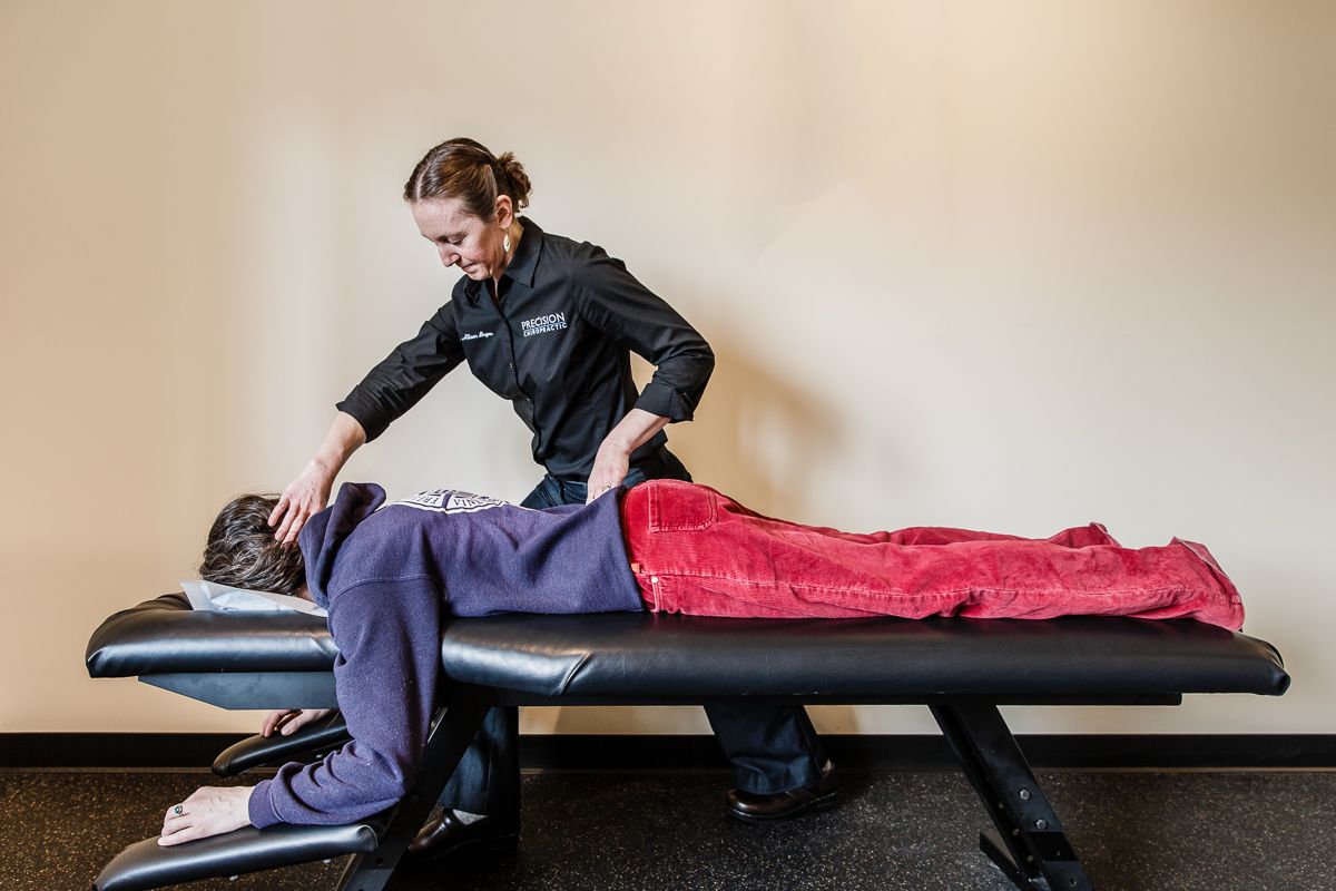 Dr. Allison from Precision Chiropractic Vermont utilizing Gentle and  Specific chiropractic care on a patient