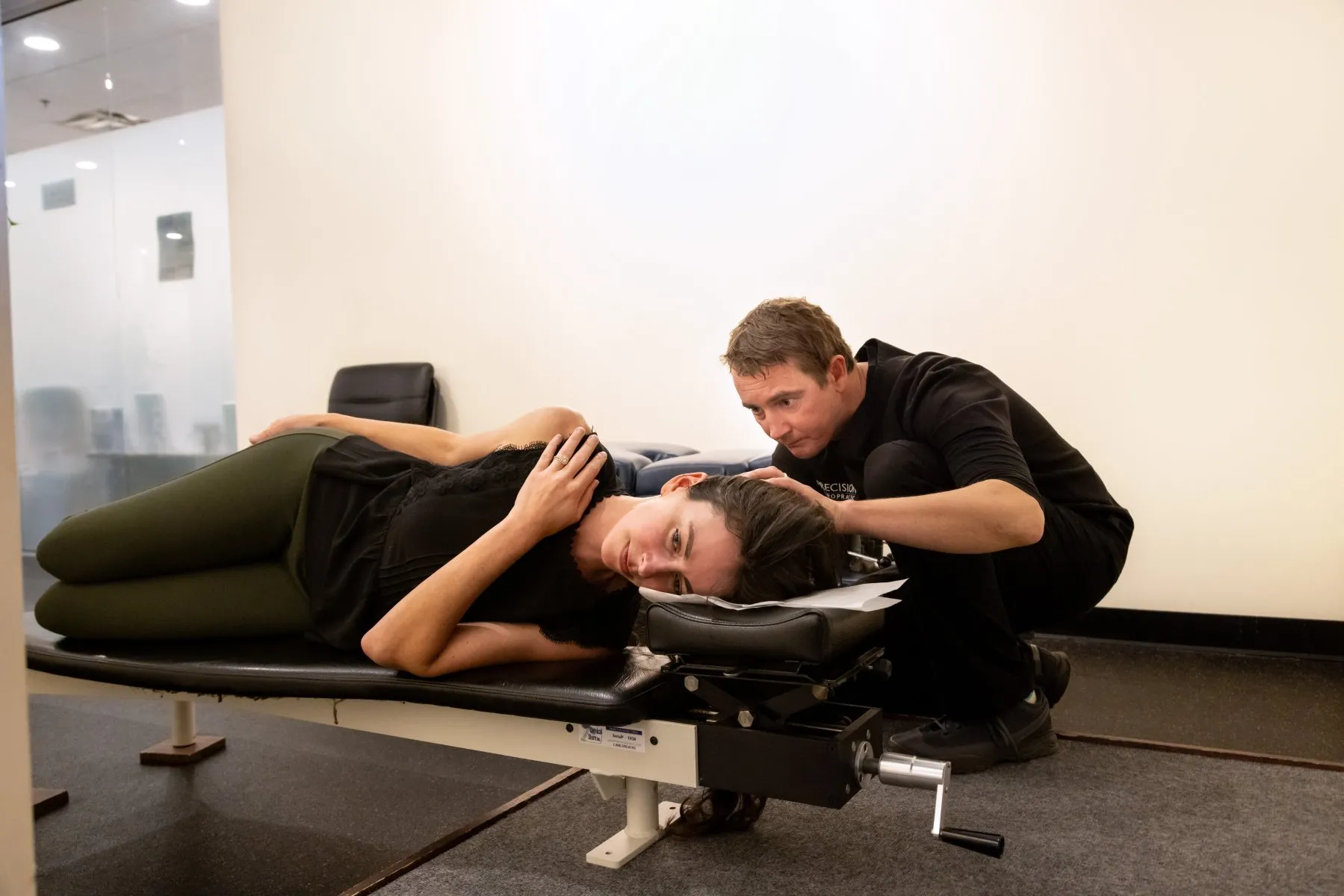 Chiropractor performing a gentle, NUCCA-style atlas adjustment on a patient as part of upper cervical chiropractic care in Vermont.